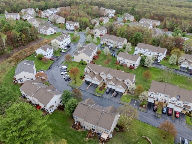 aerial view featuring a residential view and a view of trees