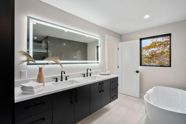 bathroom featuring tile patterned floors, vanity, and independent shower and bath