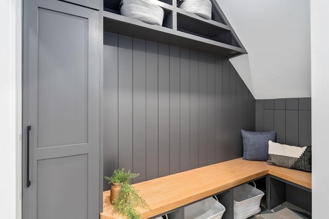 mudroom featuring lofted ceiling