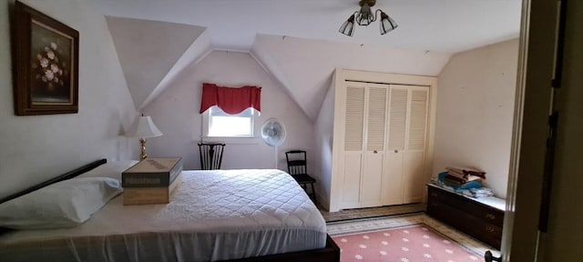 bedroom featuring a closet and lofted ceiling