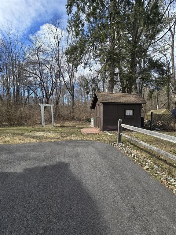 view of road with aphalt driveway