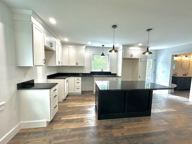 90 Bald Mountain Rd, Bernardston, MA 01337 - kitchen with recessed lighting, a center island, dark wood finished floors, white cabinetry, and dark countertops