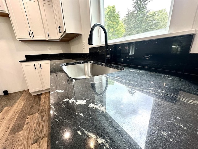 90 Bald Mountain Rd, Bernardston, MA 01337 - kitchen with a sink, dark stone countertops, and white cabinets