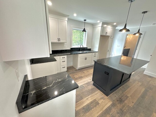 90 Bald Mountain Rd, Bernardston, MA 01337 - kitchen with a sink, light wood finished floors, white cabinetry, recessed lighting, and decorative light fixtures