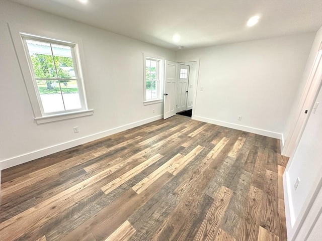 90 Bald Mountain Rd, Bernardston, MA 01337 - unfurnished bedroom featuring multiple windows, dark wood finished floors, baseboards, and recessed lighting