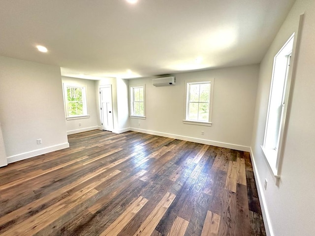 90 Bald Mountain Rd, Bernardston, MA 01337 - unfurnished room featuring a wall mounted air conditioner, plenty of natural light, dark wood finished floors, baseboards, and recessed lighting