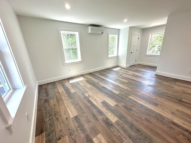 90 Bald Mountain Rd, Bernardston, MA 01337 - unfurnished room with dark wood-style flooring, an AC wall unit, baseboards, and recessed lighting