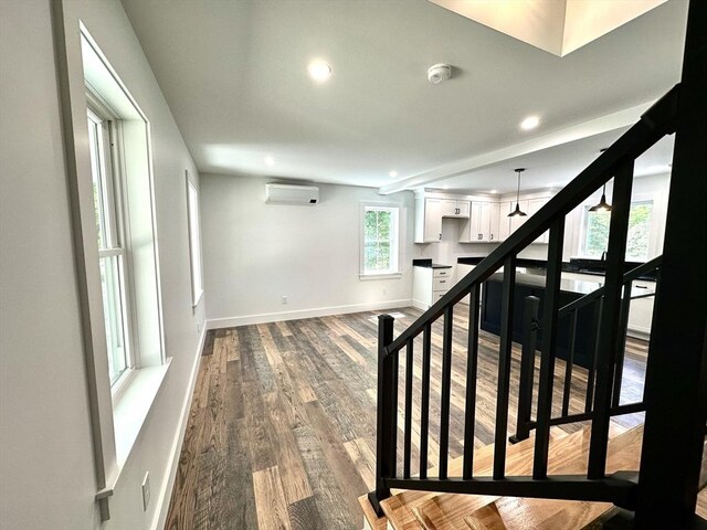 90 Bald Mountain Rd, Bernardston, MA 01337 - stairway with an AC wall unit, wood finished floors, recessed lighting, and baseboards