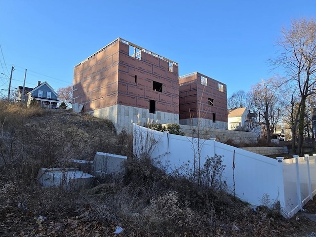 view of property exterior with an outdoor structure