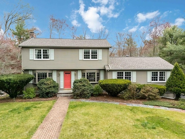 10 Mallard Rd, Acton, MA 01720 - colonial-style house with roof with shingles, a front lawn, and a chimney
