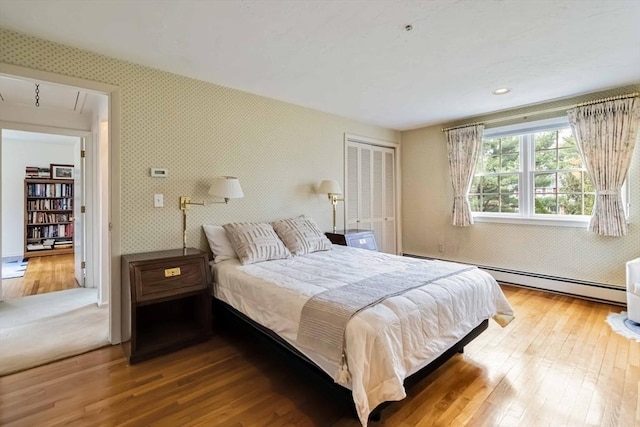 10 Mallard Rd, Acton, MA 01720 - bedroom with wallpapered walls, attic access, baseboard heating, and hardwood / wood-style flooring