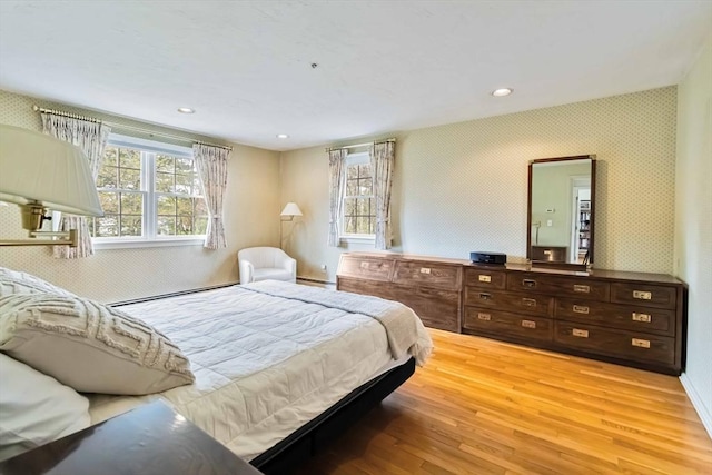 10 Mallard Rd, Acton, MA 01720 - bedroom with recessed lighting, baseboard heating, baseboards, wallpapered walls, and light wood-style floors