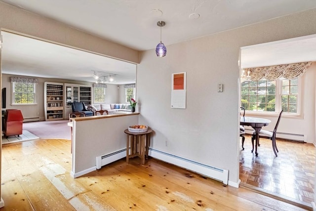 10 Mallard Rd, Acton, MA 01720 - kitchen with light wood-style flooring and a baseboard heating unit