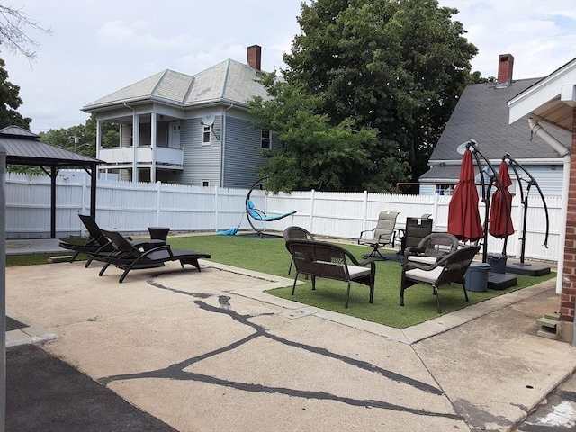 view of patio / terrace featuring a fenced backyard and a gazebo