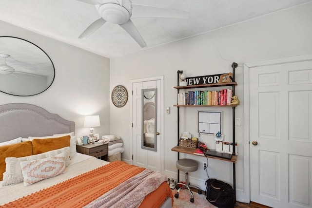 bedroom featuring baseboards and ceiling fan