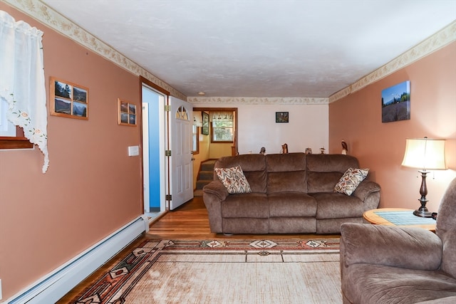 living room with light hardwood / wood-style flooring and a baseboard radiator