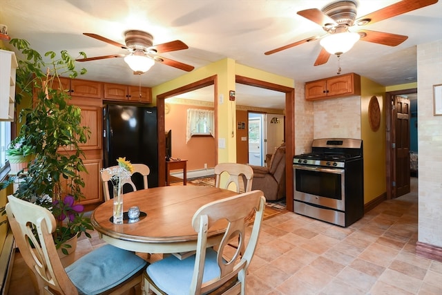 dining space featuring a baseboard heating unit and ceiling fan