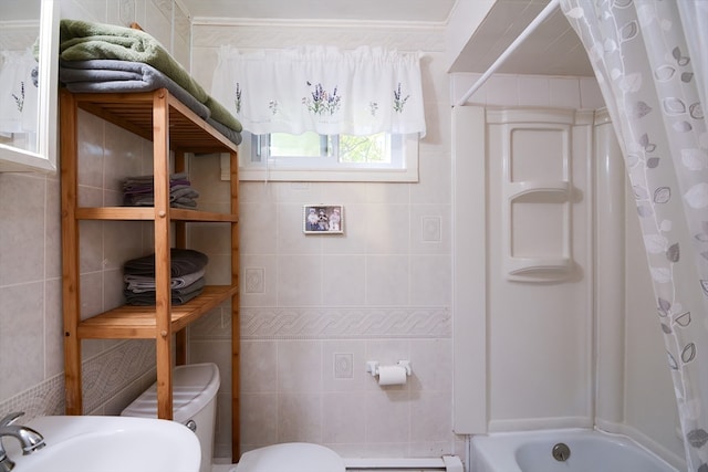 full bathroom featuring a baseboard radiator, shower / bathtub combination with curtain, tile walls, toilet, and sink