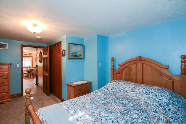 carpeted bedroom featuring a closet