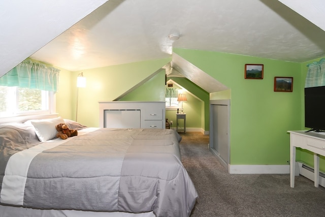 carpeted bedroom featuring baseboard heating and vaulted ceiling