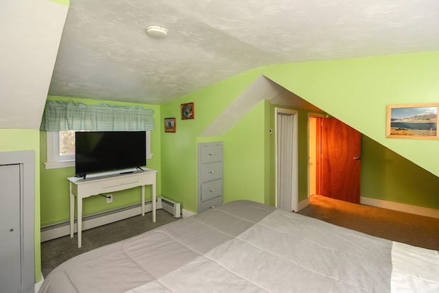 carpeted bedroom with vaulted ceiling, a baseboard heating unit, and a textured ceiling