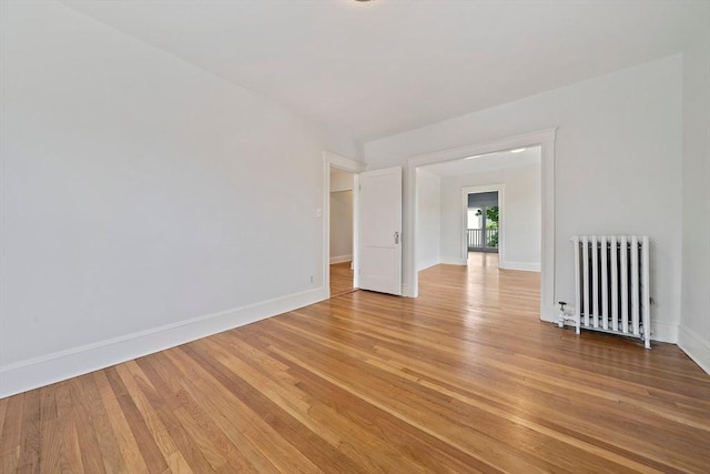 32 Gibson Unit 2, Boston, MA 02122 - unfurnished room with radiator heating unit and light wood-style floors
