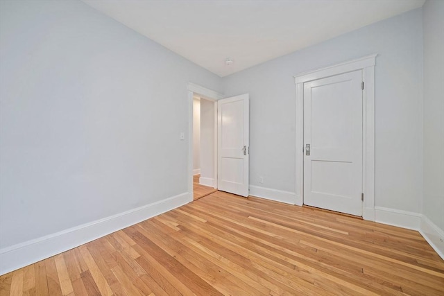 32 Gibson Unit 2, Boston, MA 02122 - unfurnished bedroom featuring baseboards and light wood-style floors