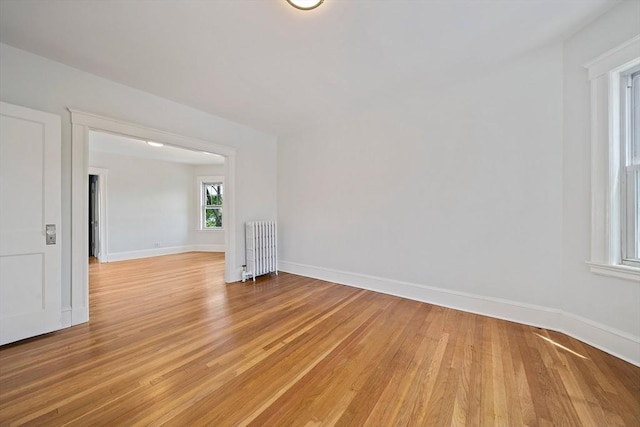 32 Gibson Unit 2, Boston, MA 02122 - empty room featuring radiator heating unit and light wood-type flooring