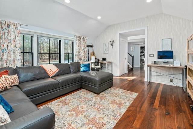 living room featuring dark hardwood / wood-style flooring and vaulted ceiling