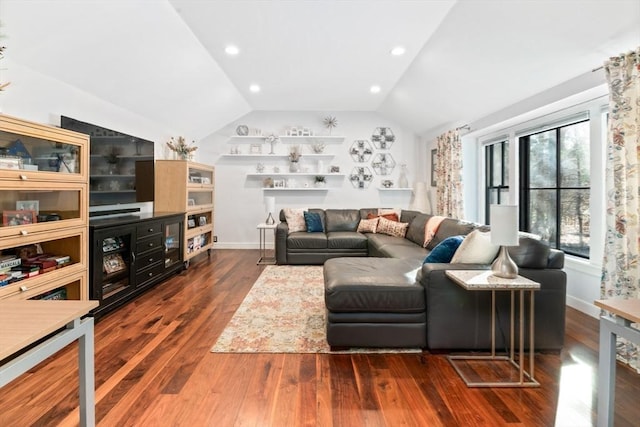 living room featuring dark hardwood / wood-style floors and lofted ceiling