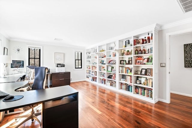 office space with hardwood / wood-style floors and crown molding