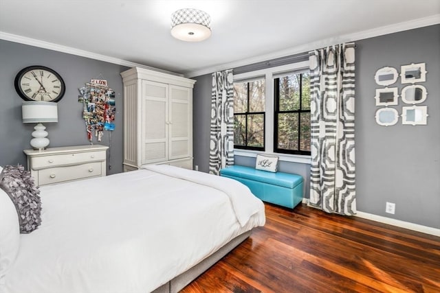 bedroom with crown molding and dark wood-type flooring