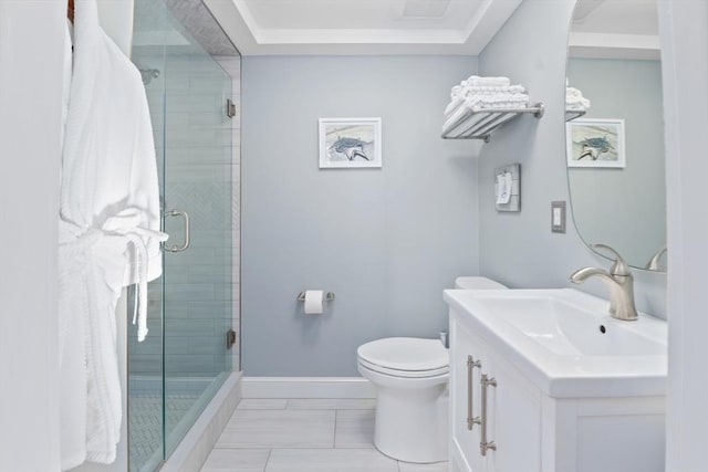 bathroom with an enclosed shower, vanity, and toilet