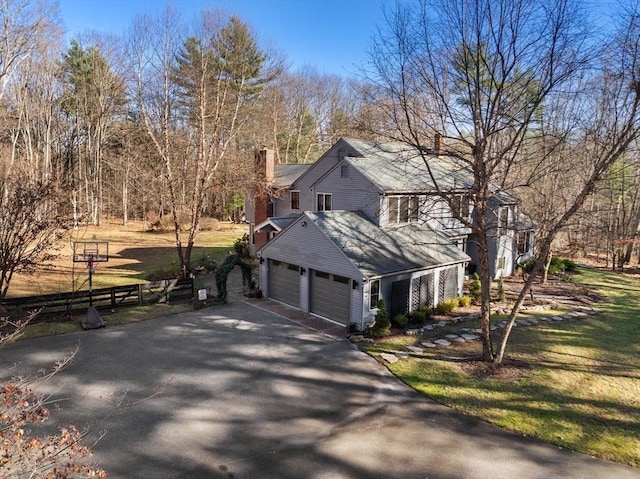 view of side of property featuring a yard