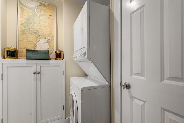 laundry room with stacked washer and dryer