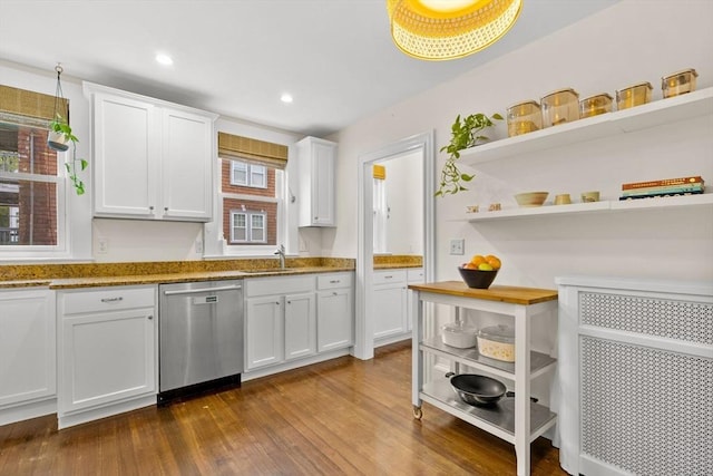 kitchen with dishwasher, a sink, open shelves, white cabinetry, and dark wood-style floors