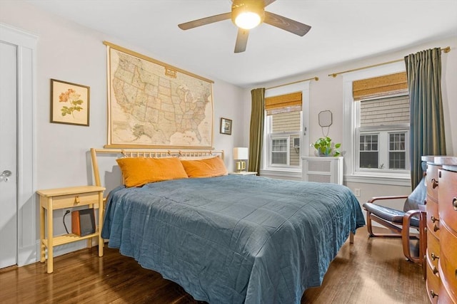 bedroom with wood finished floors and ceiling fan