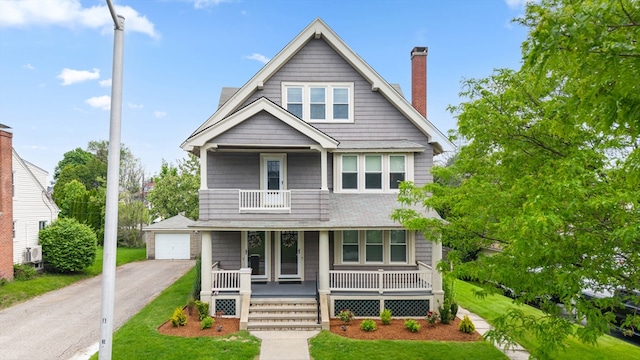 23 Devens Rd, Worcester, MA 01606 - view of front of home featuring a porch, a chimney, a garage, a balcony, and a front yard