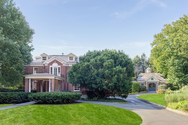 view of front of home with a front lawn