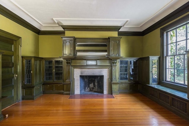 87 Hammond St, Newton, MA 02467 - unfurnished living room featuring a fireplace, wood finished floors, and ornamental molding