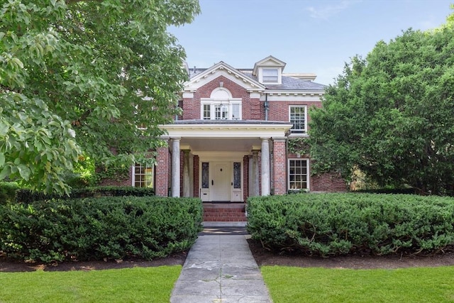 87 Hammond St, Newton, MA 02467 - georgian-style home with brick siding and covered porch