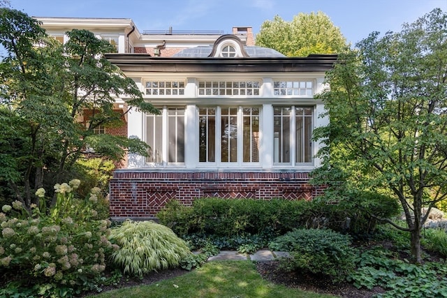 exterior space featuring a sunroom