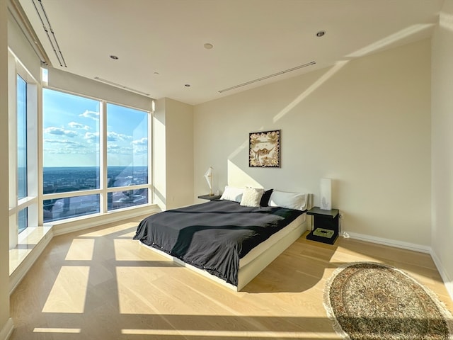 bedroom with light hardwood / wood-style flooring