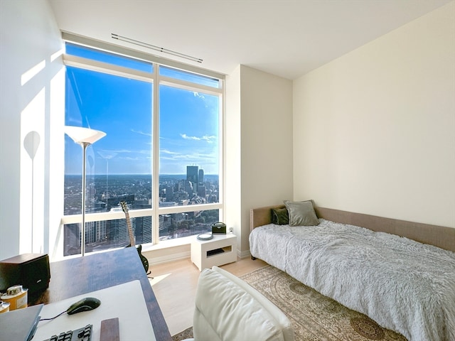 bedroom with hardwood / wood-style floors