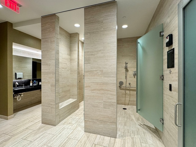 bathroom featuring a shower with door