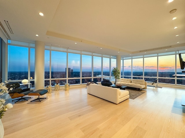 living room featuring light hardwood / wood-style flooring and floor to ceiling windows