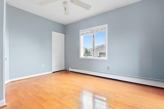80 Lennox Rd Unit 1, Nahant, MA 01908 - unfurnished bedroom featuring light wood finished floors, baseboard heating, baseboards, and a closet