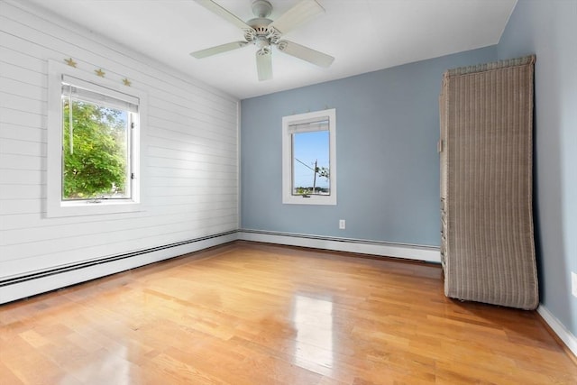80 Lennox Rd Unit 1, Nahant, MA 01908 - spare room with light wood-style flooring, a ceiling fan, a baseboard heating unit, and baseboards