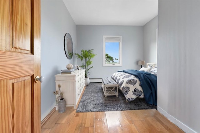 80 Lennox Rd Unit 1, Nahant, MA 01908 - bedroom featuring light wood finished floors, baseboard heating, and baseboards