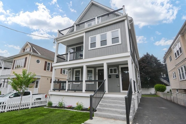 57 Garrison Ave Unit 57, Somerville, MA 02144 - view of front facade featuring a balcony, a porch, and board and batten siding